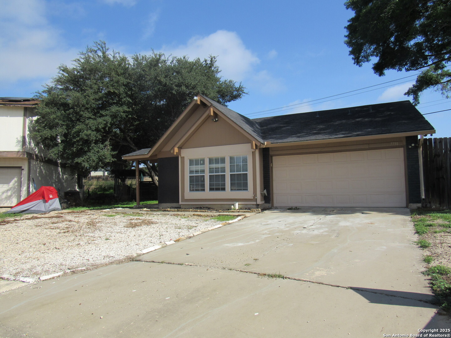 7731 Clear Ridge Drive San Antonio, TX 78239 - Photo 2 of 54 a front view of a house with a yard and garage