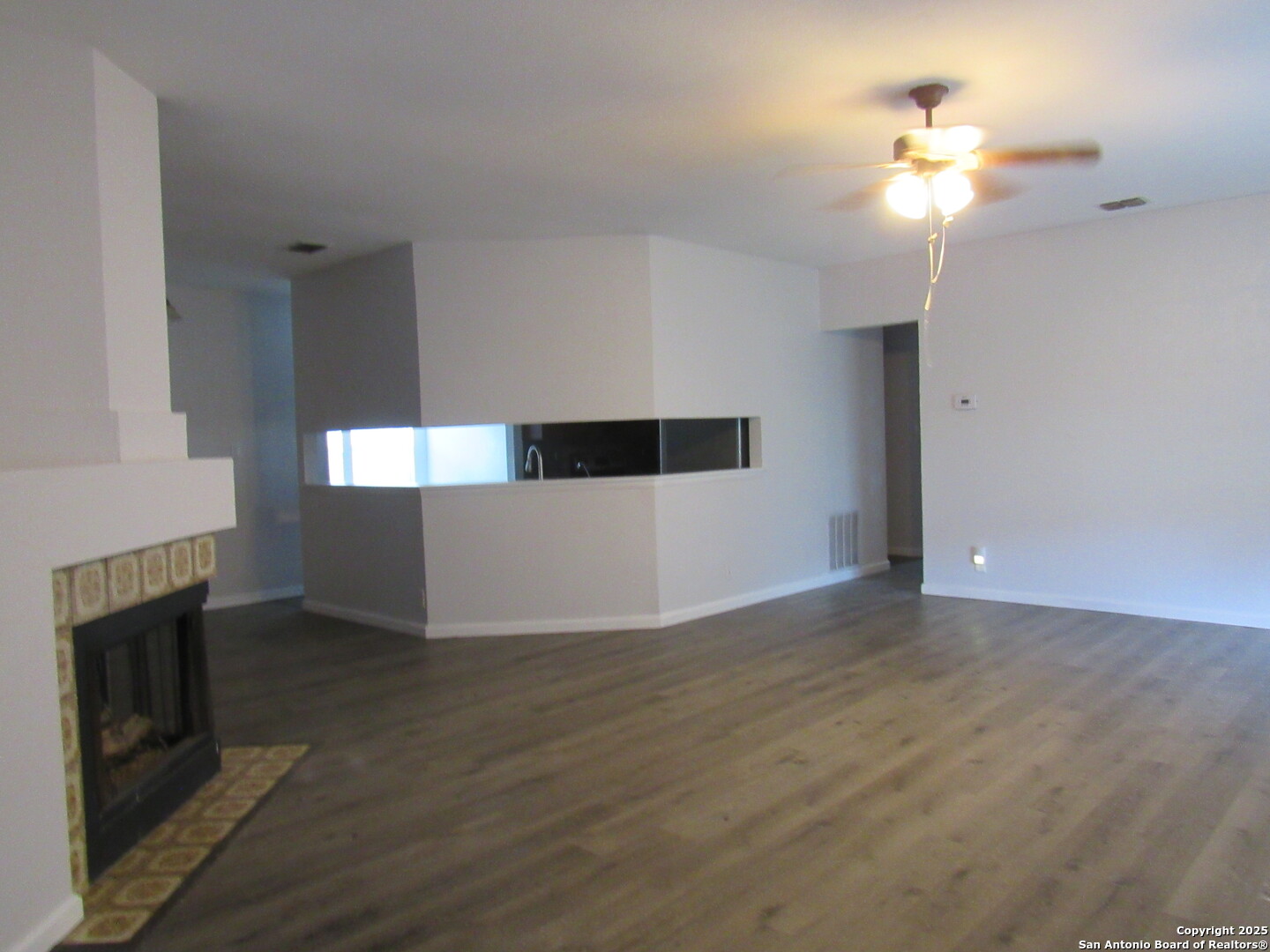 7731 Clear Ridge Drive San Antonio, TX 78239 - Photo 21 of 54 a view of an empty room with a fireplace