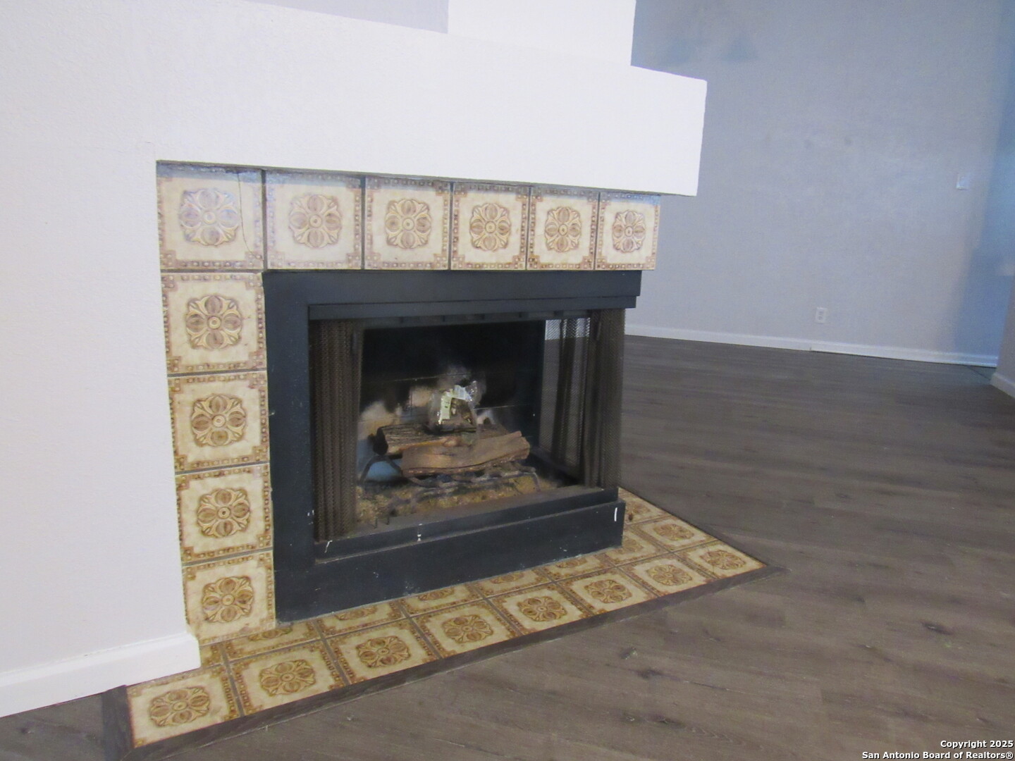 7731 Clear Ridge Drive San Antonio, TX 78239 - Photo 23 of 54 a fireplace with a vase on top of it