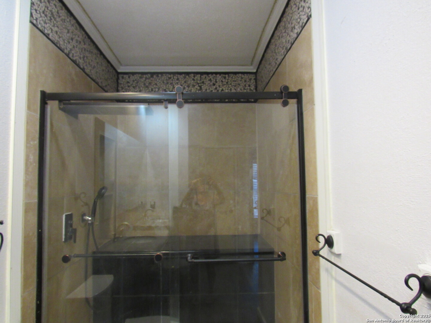 7731 Clear Ridge Drive San Antonio, TX 78239 - Photo 38 of 54 a bathroom with a glass shower door