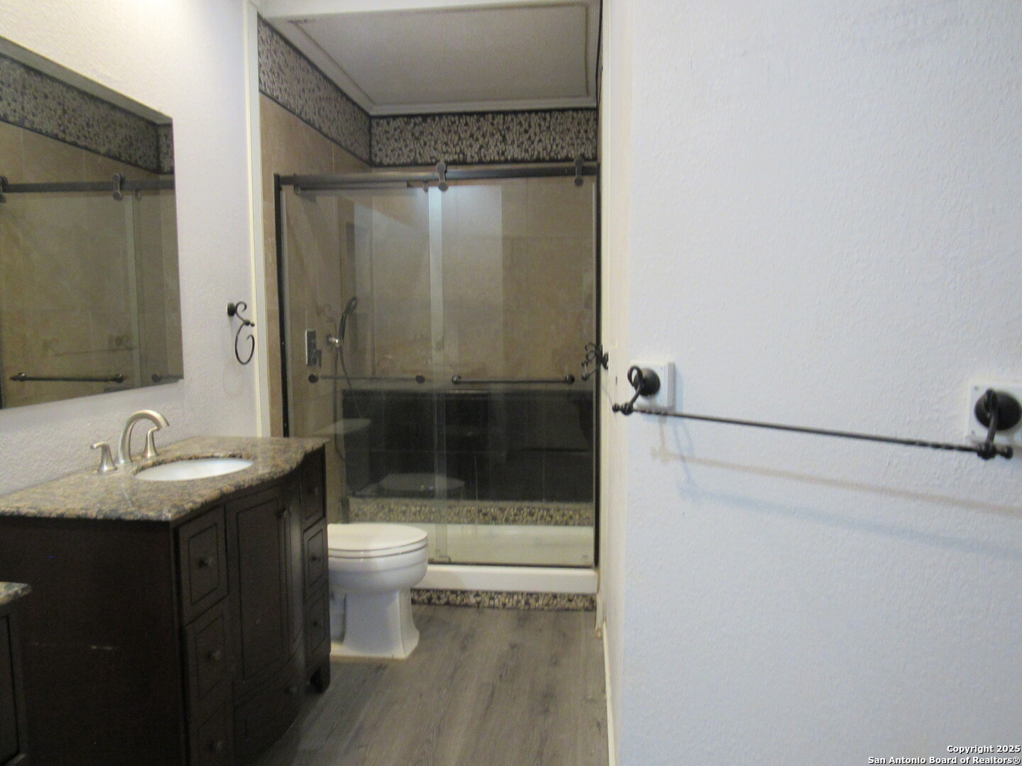 7731 Clear Ridge Drive San Antonio, TX 78239 - Photo 40 of 54 a bathroom with a sink and a mirror