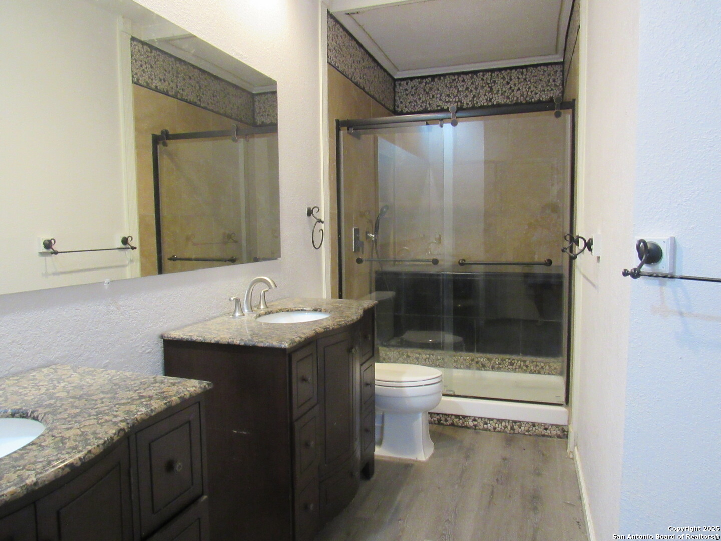 7731 Clear Ridge Drive San Antonio, TX 78239 - Photo 42 of 54 a bathroom with a sink a toilet and shower