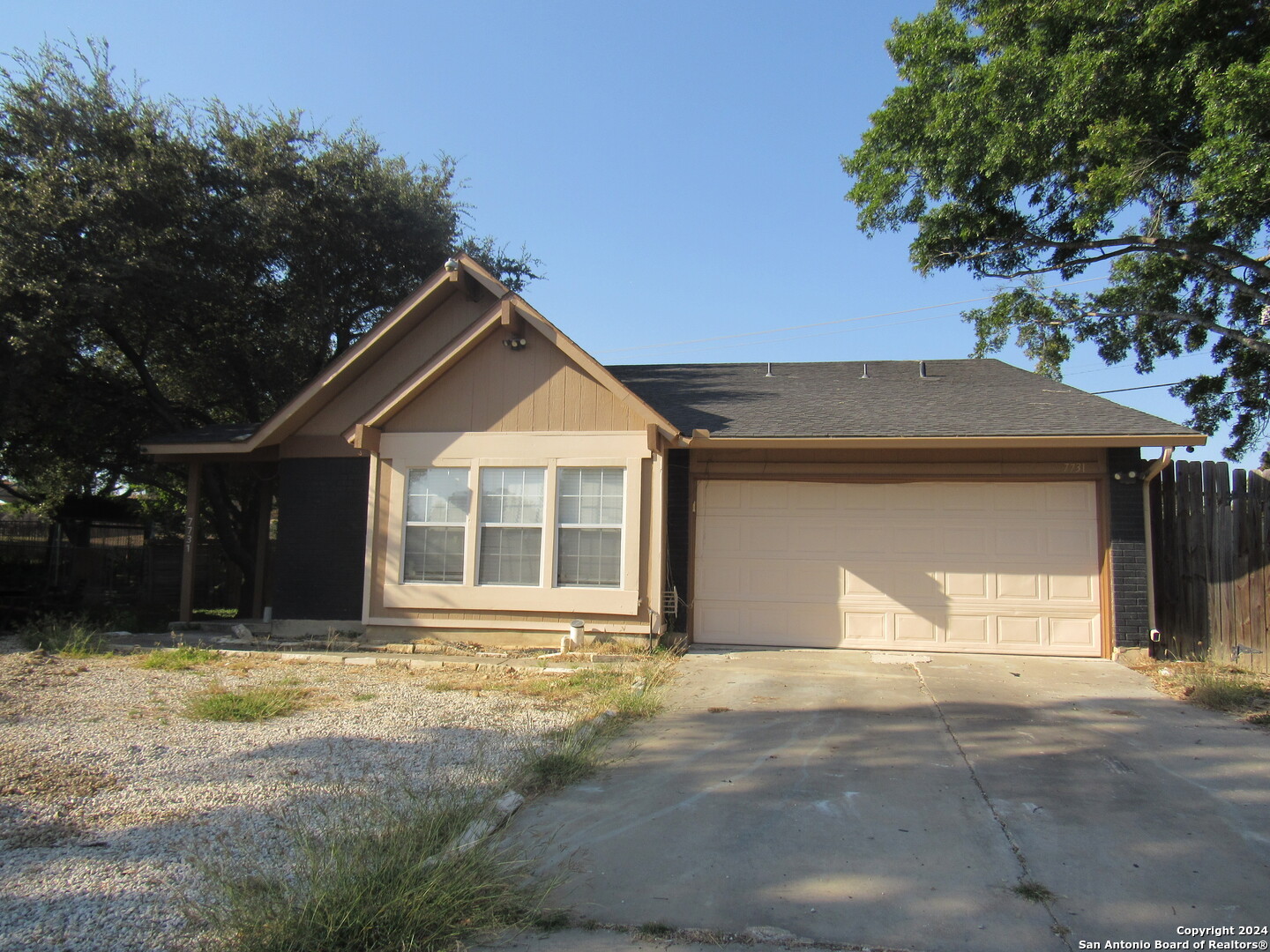 7731 Clear Ridge Drive San Antonio, TX 78239 - Photo 45 of 54 a front view of a house with a yard and garage