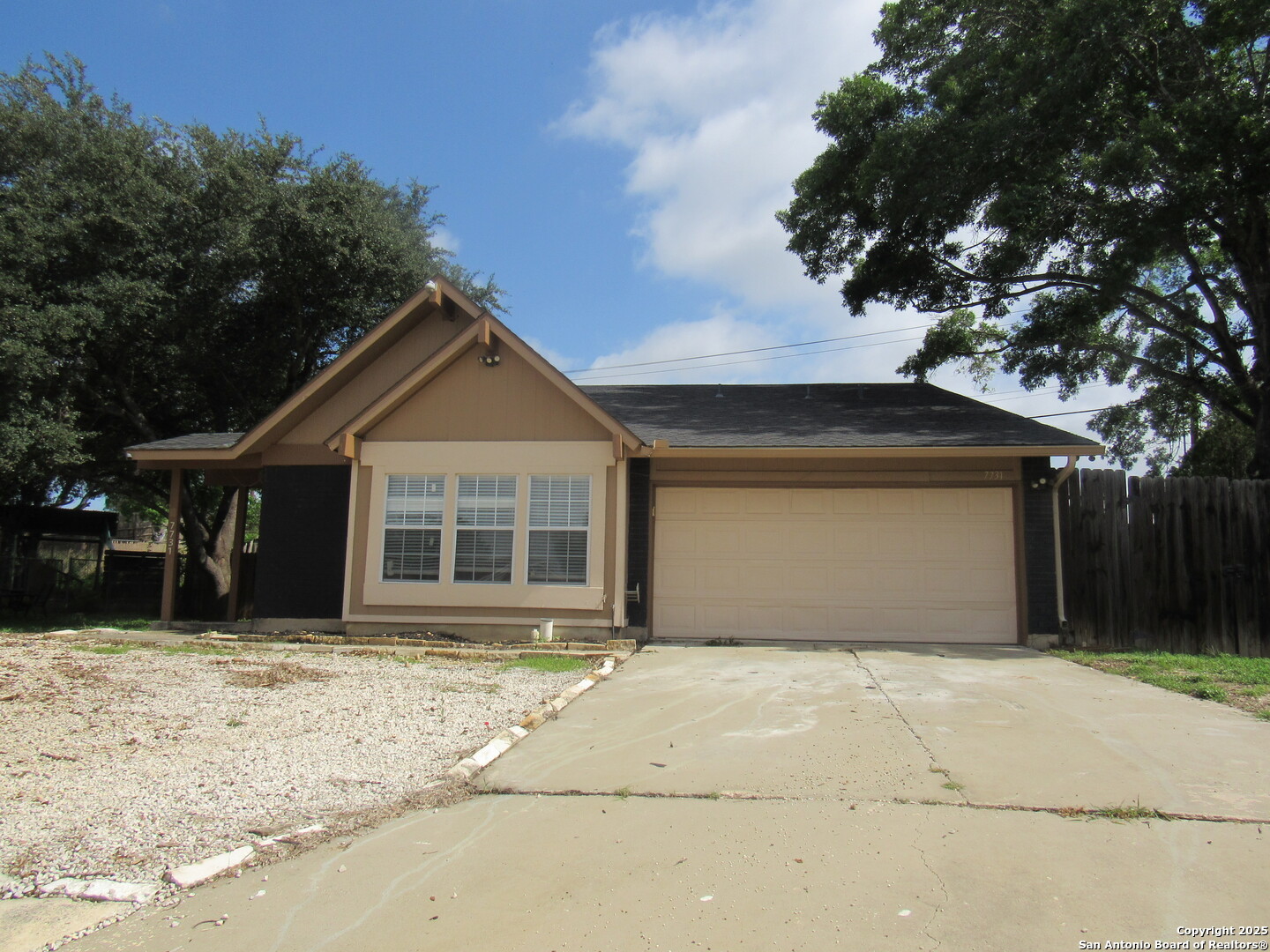 7731 Clear Ridge Drive San Antonio, TX 78239 - Photo 5 of 54 a front view of a house with a yard and garage
