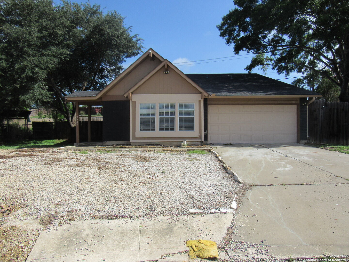 7731 Clear Ridge Drive San Antonio, TX 78239 - Photo 6 of 54 a front view of a house with a yard and garage