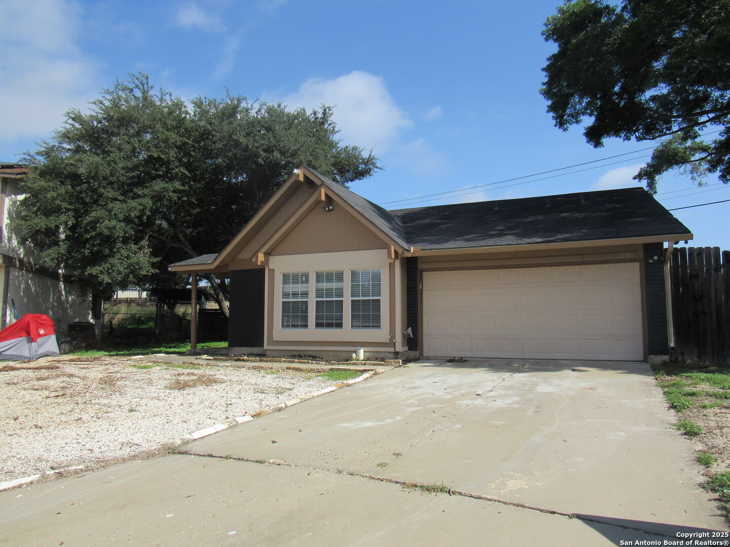 7731 Clear Ridge Drive San Antonio, TX 78239 - Photo 7 of 54 a front view of a house with a yard
