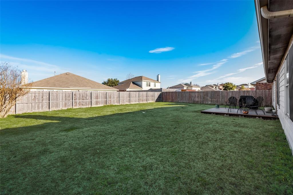 1202 Halifax Lane Forney, TX 75126 - Photo 4 of 5 a view of a big house with a big yard and large tree