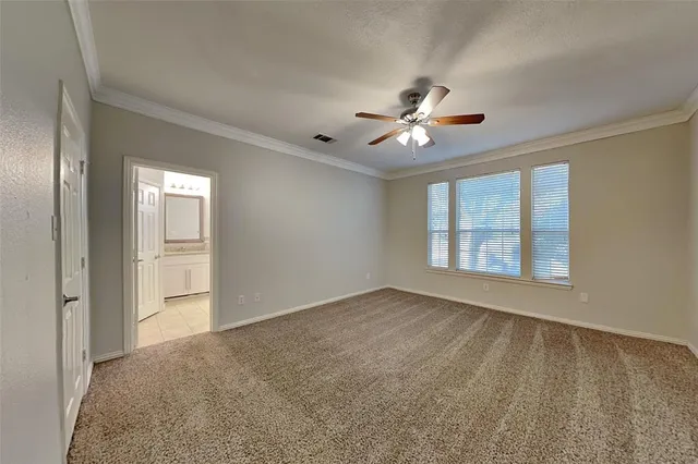 a view of a room with wooden floor and a rug