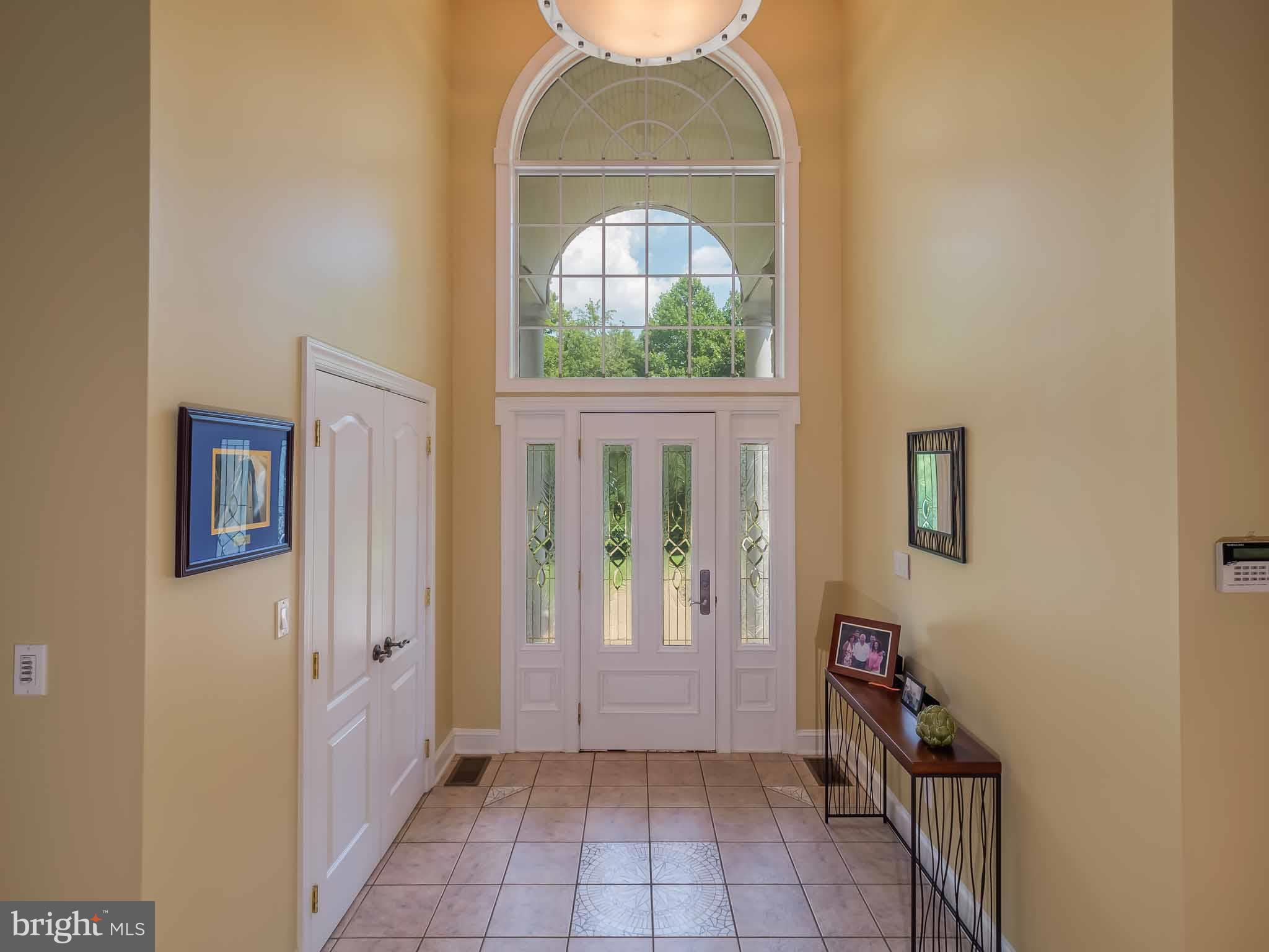 4840 Bayside Road Chesapeake Beach, MD 20732 - Photo 3 of 69 Tiled Floor Entrance with magnificent lighting