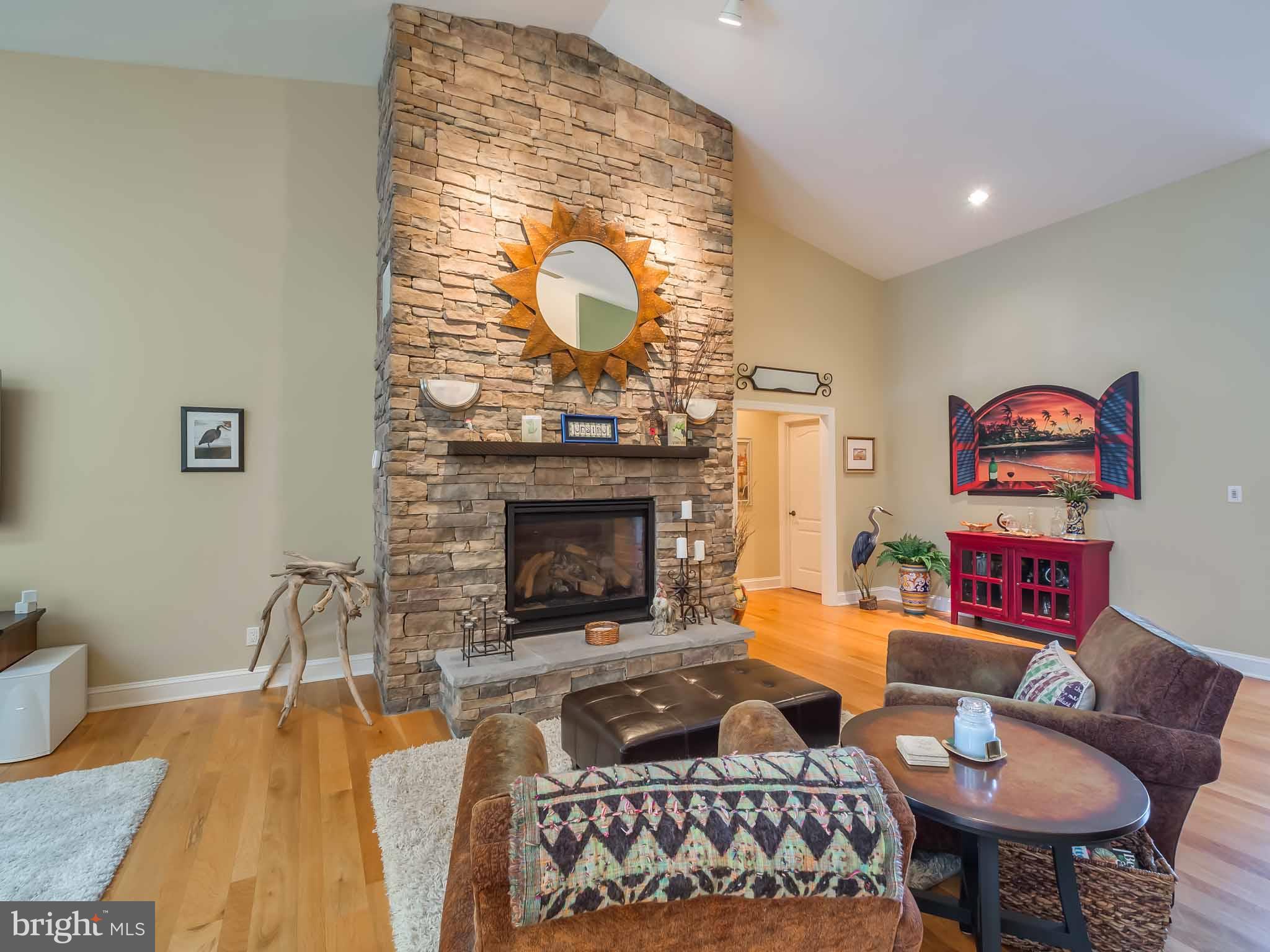 4840 Bayside Road Chesapeake Beach, MD 20732 - Photo 5 of 69 Layered stone gas fireplace from floor to ceiling