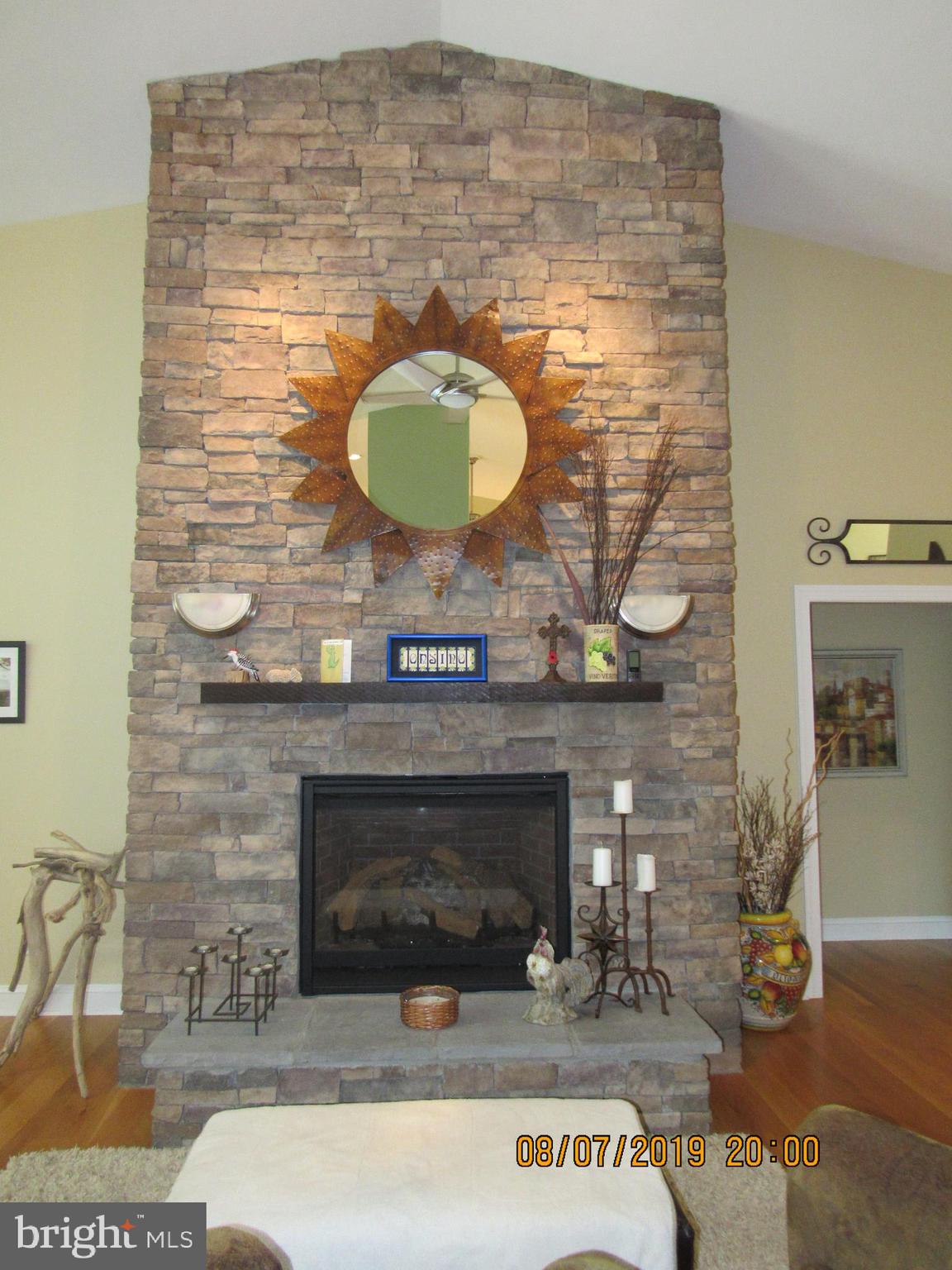 4840 Bayside Road Chesapeake Beach, MD 20732 - Photo 6 of 69 As tall as the cathedral ceiling is this fireplace