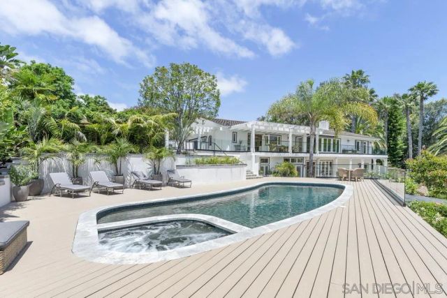 a view of a swimming pool with a patio
