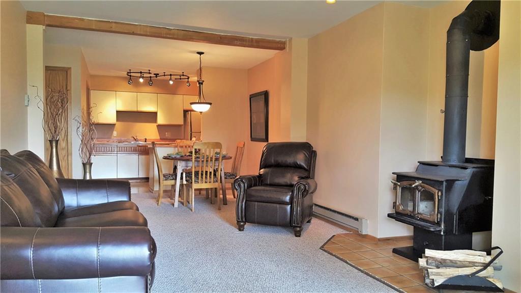875 4 O Clock Road, Unit D1 Breckenridge, CO 80424 - Photo 2 of 25 a living room with furniture and a large window