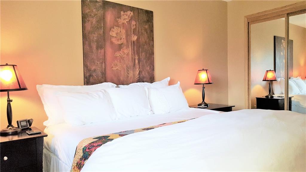 875 4 O Clock Road, Unit D1 Breckenridge, CO 80424 - Photo 10 of 25 a bedroom with a bed and a night stand