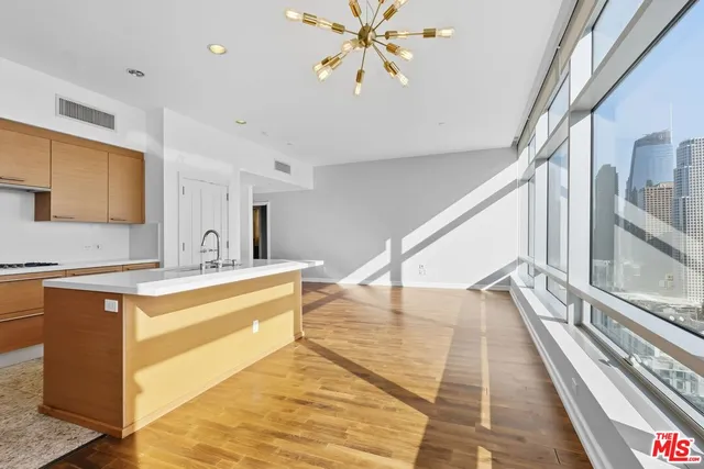 a spacious bathroom with a tub and mirror