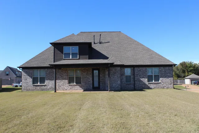 a front view of a house with patio