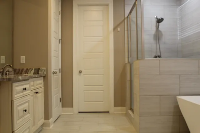 a bathroom with a shower and a sink