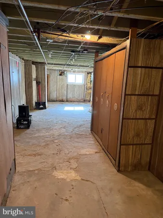 a view of hallway with wooden walls