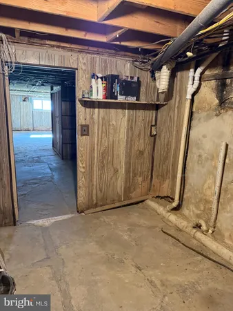 a view of a room with wooden walls