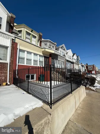 a view of a brick building with many windows