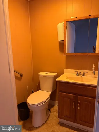 a bathroom with a toilet and a sink