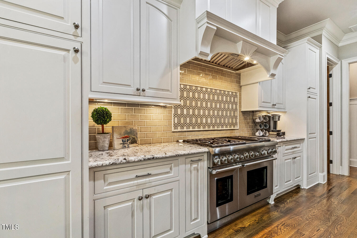 1205 Queensferry Road Cary, NC 27511 - Photo 13 of 63 a kitchen with granite countertop cabinets stainless steel appliances and a sink