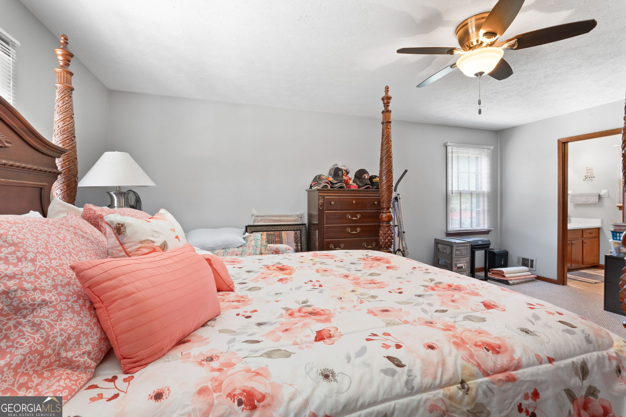 2050 North McDonough Road Griffin, GA 30223 - Photo 14 of 42 a bedroom with a bed and a chandelier
