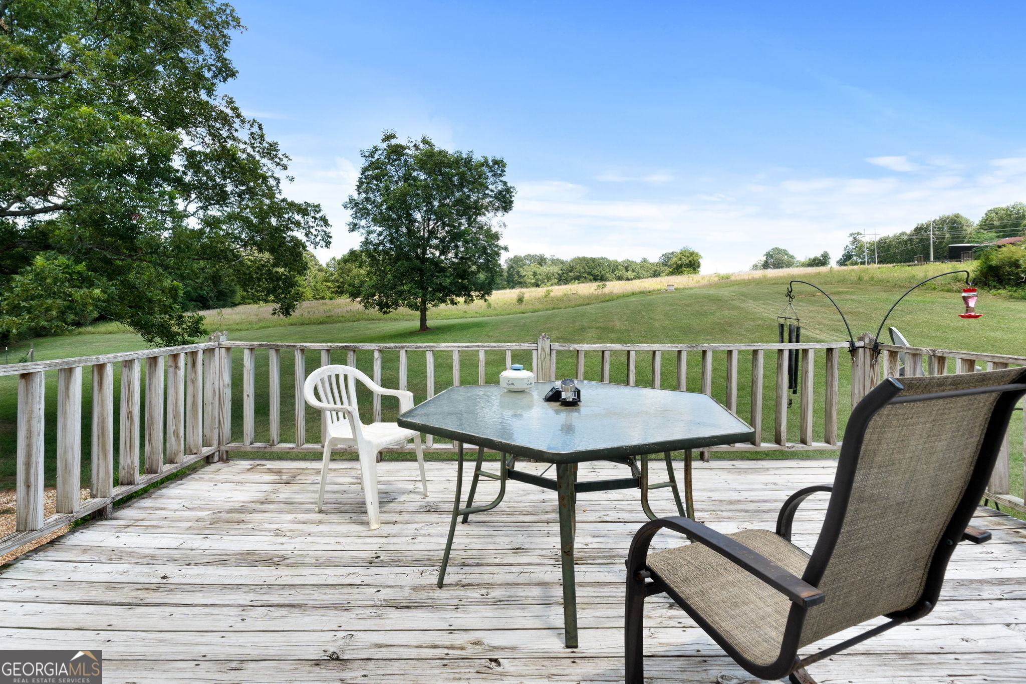 2050 North McDonough Road Griffin, GA 30223 - Photo 18 of 42 a view of a chairs and table on the deck