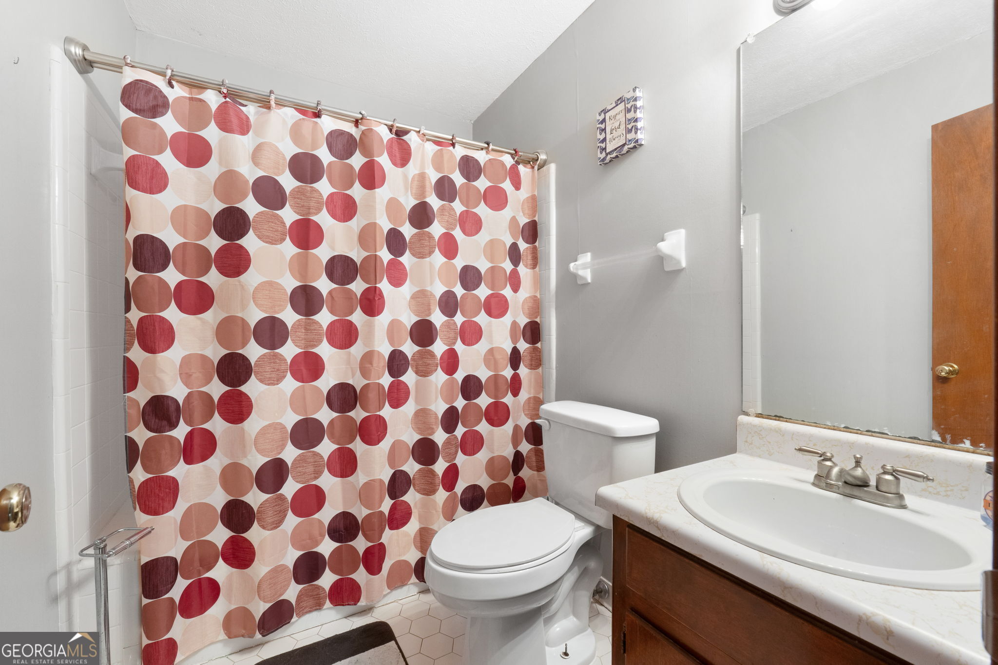 2050 North McDonough Road Griffin, GA 30223 - Photo 23 of 42 a bathroom with a sink toilet and shower