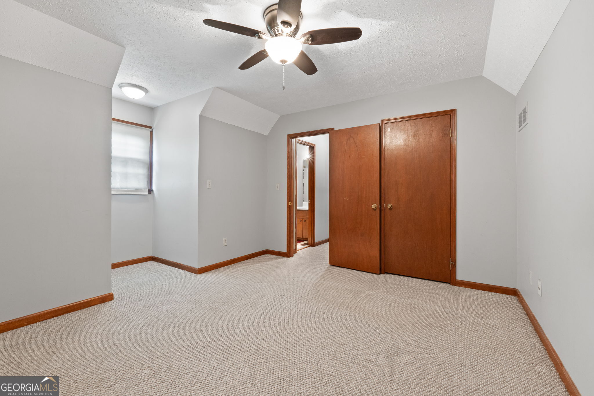 2050 North McDonough Road Griffin, GA 30223 - Photo 25 of 42 a view of an empty room with a ceiling fan