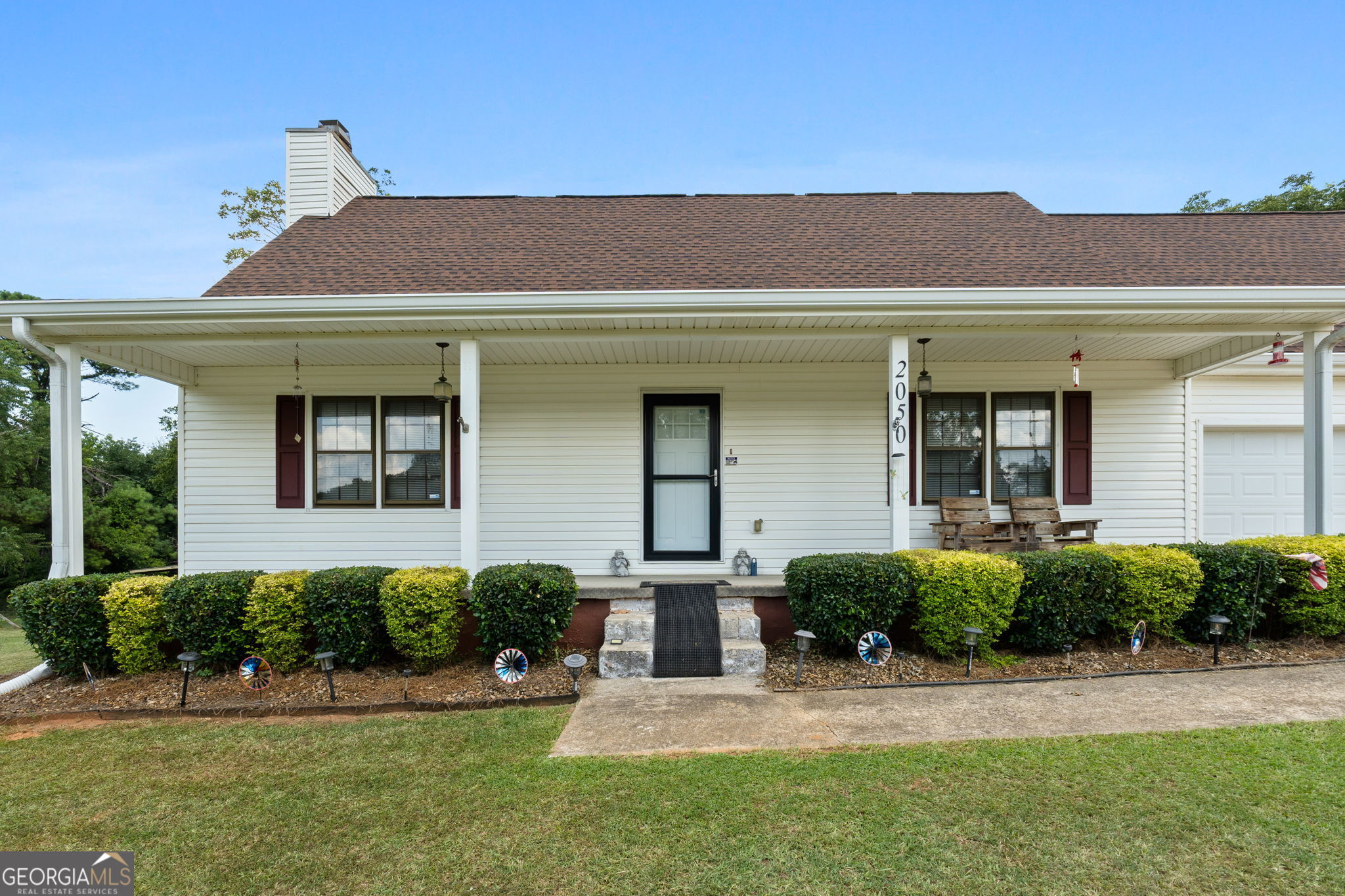 2050 North McDonough Road Griffin, GA 30223 - Photo 4 of 42 a front view of a house with a yard