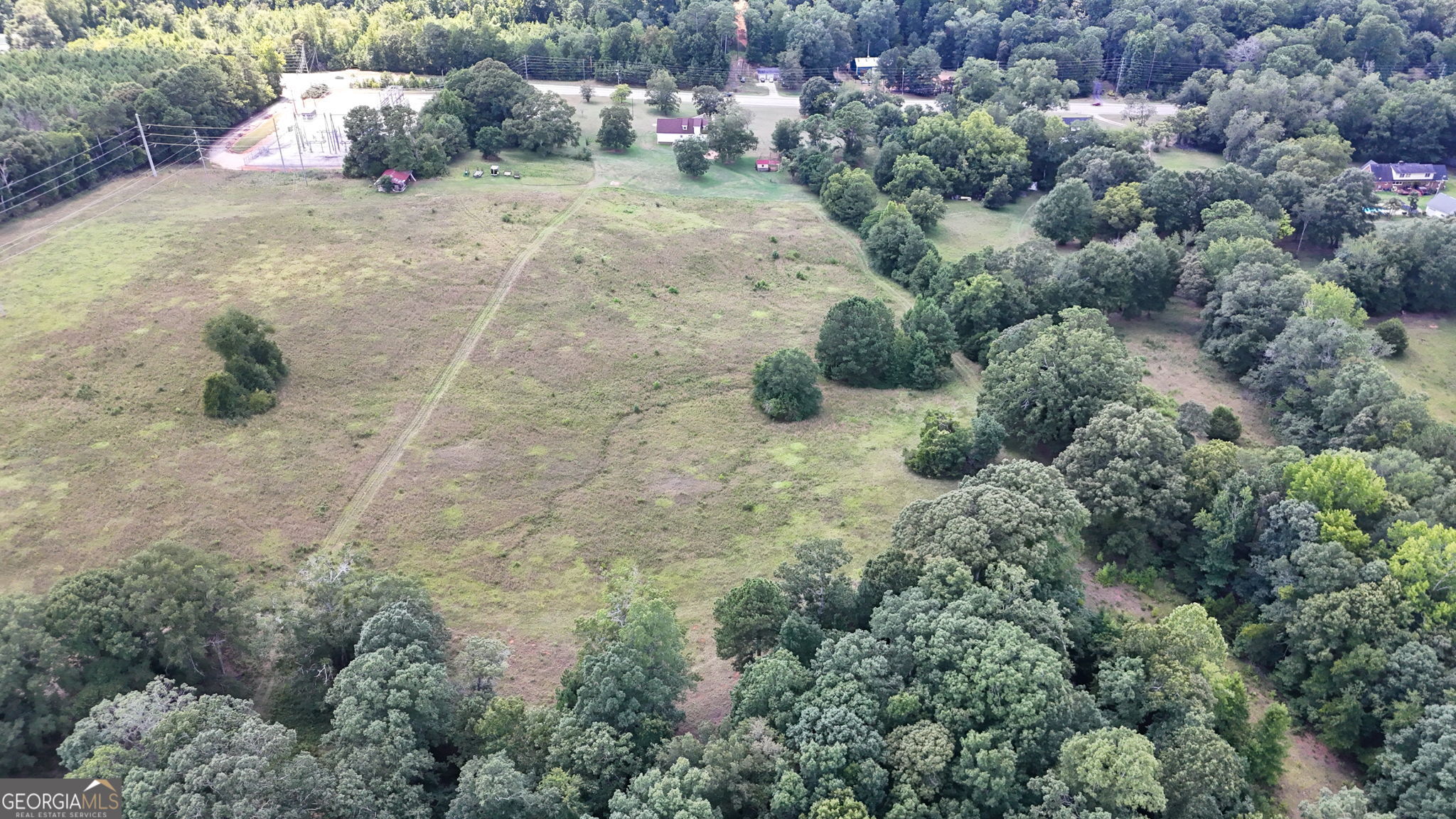 2050 North McDonough Road Griffin, GA 30223 - Photo 41 of 42 a view of a dry yard with lots of green space