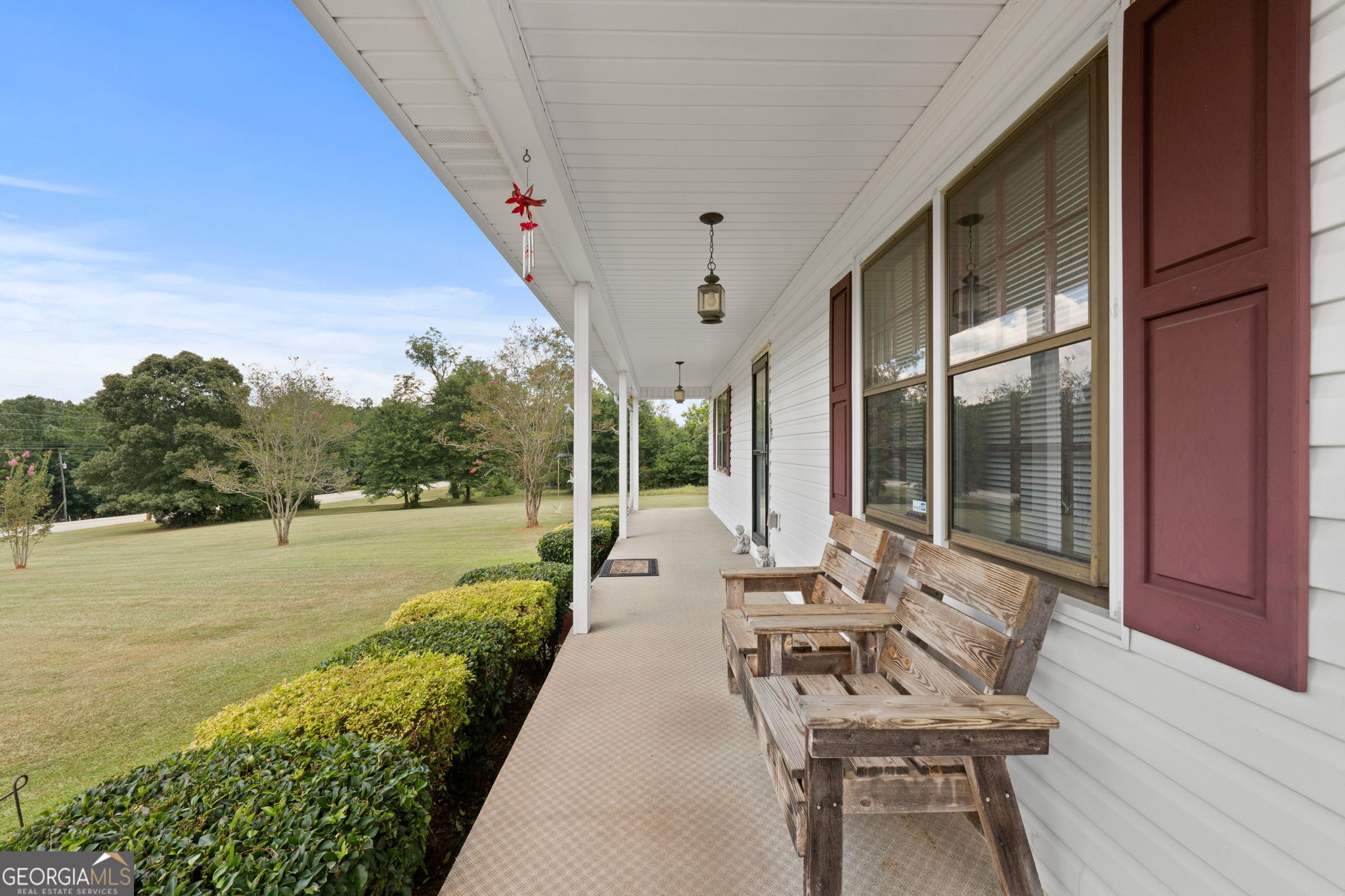2050 North McDonough Road Griffin, GA 30223 - Photo 5 of 42 a view of a patio with couches plants and large swimming pool