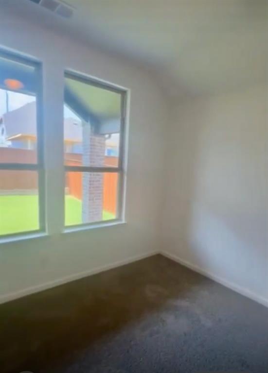 3121 Winecup Way Little Elm, TX 75068 - Photo 13 of 23 an empty room with a window