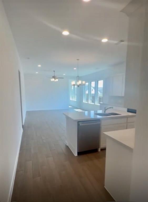 3121 Winecup Way Little Elm, TX 75068 - Photo 14 of 23 a view of cabinets and kitchen island with sink