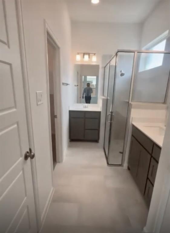 3121 Winecup Way Little Elm, TX 75068 - Photo 17 of 23 a bathroom with a bathtub and a shower