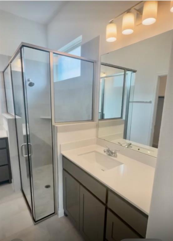 3121 Winecup Way Little Elm, TX 75068 - Photo 18 of 23 a bathroom with a sink and mirror