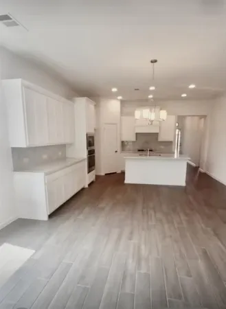 a view of cabinets with wooden floor