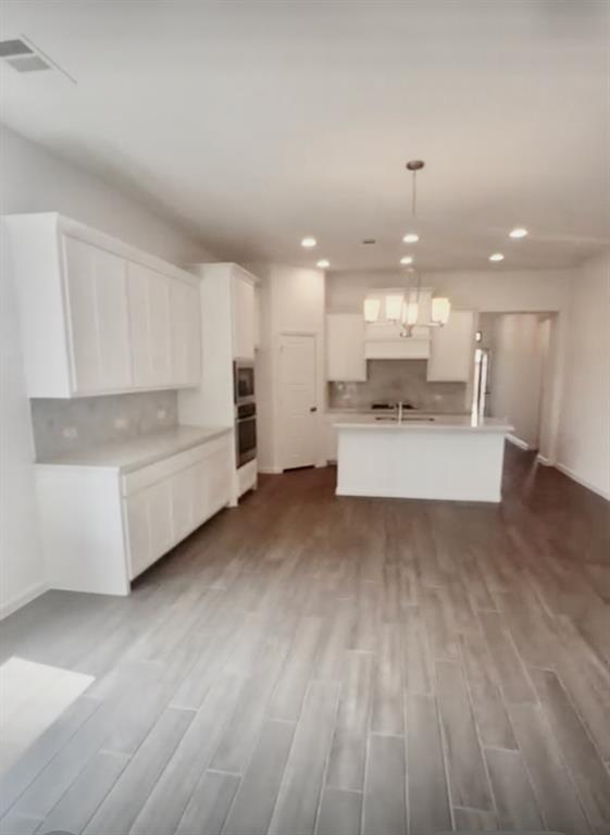 3121 Winecup Way Little Elm, TX 75068 - Photo 6 of 23 a large white kitchen with a large window