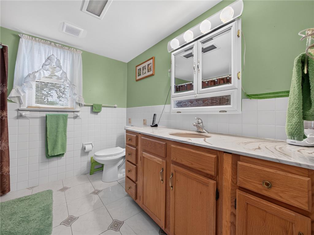 3046 Ridon Court Bethlehem, PA 18020 - Photo 36 of 41 A well-lit bathroom with a bright vanity and ample storage offers comfortable utility.