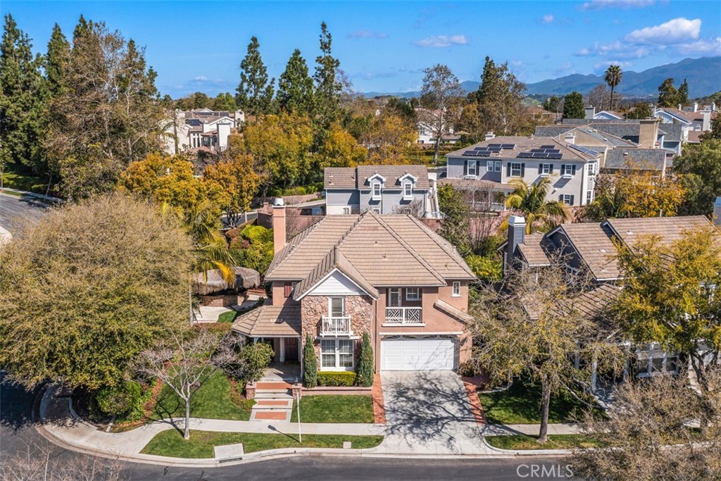 3 Hearthside Road Ladera Ranch, CA 92694 - Photo 1 of 1 a aerial view of a house with a yard fountain and a large tree