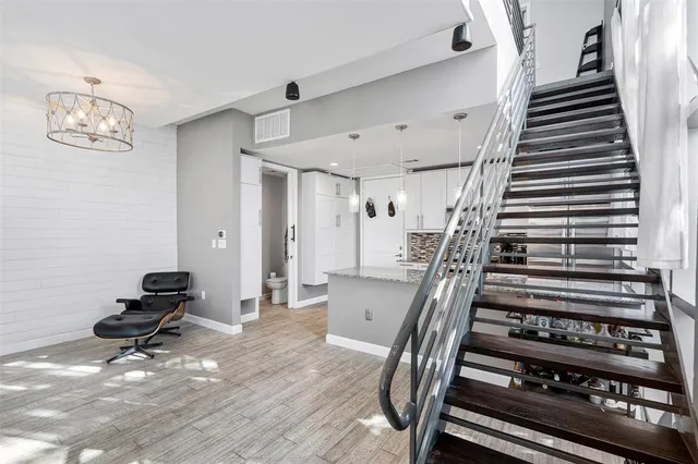 a view of entryway with stairs and wooden floor