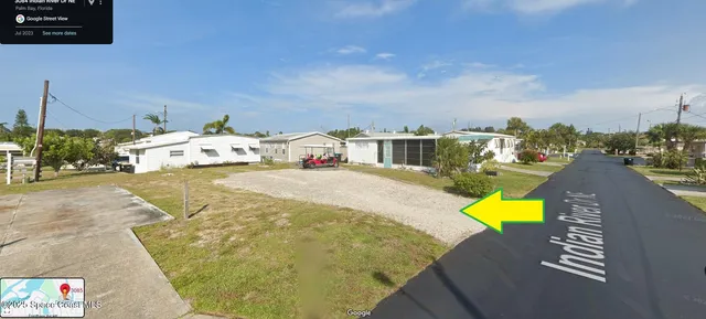 a view of a swimming pool with a lounge chairs
