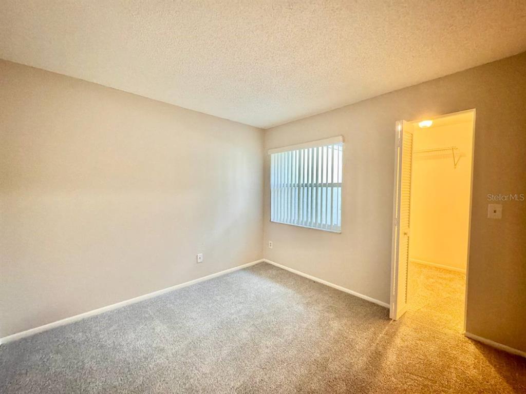 2826 Rampart Circle Clearwater, FL 33761 - Photo 17 of 30 an empty room with windows