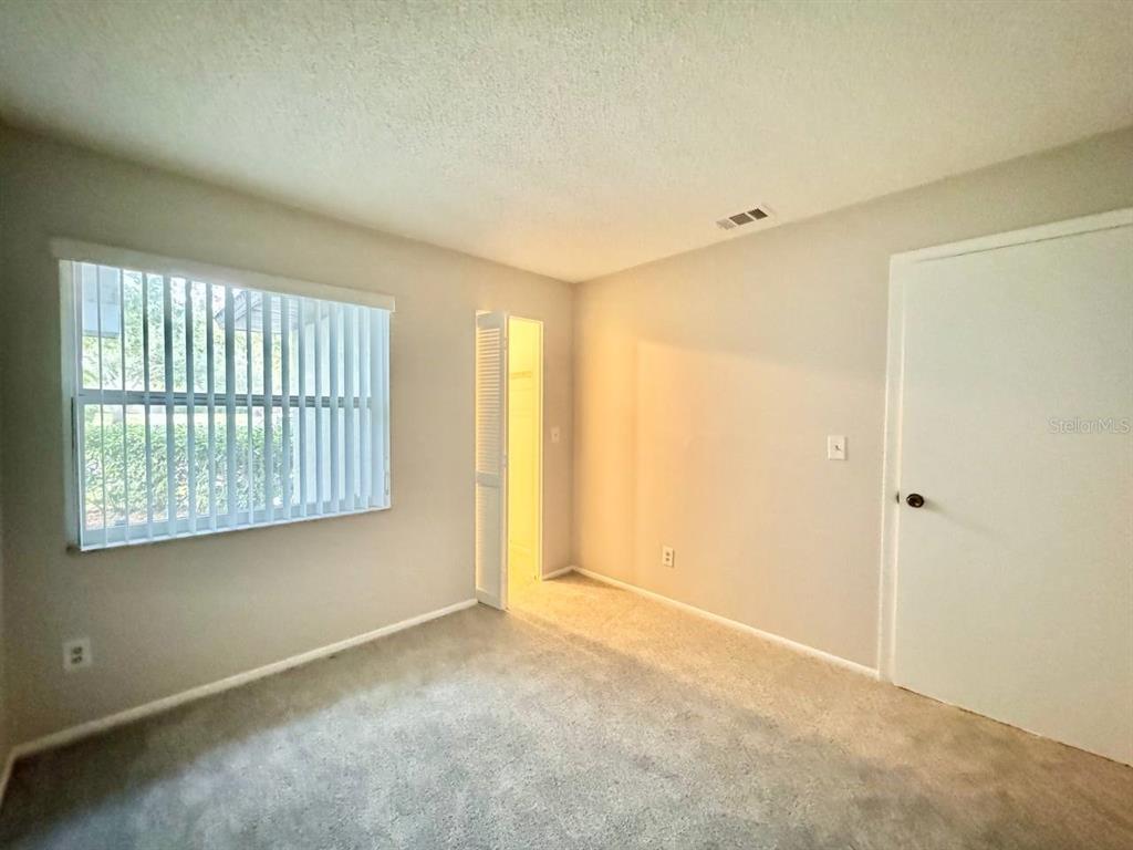2826 Rampart Circle Clearwater, FL 33761 - Photo 18 of 30 a view of an empty room with a window