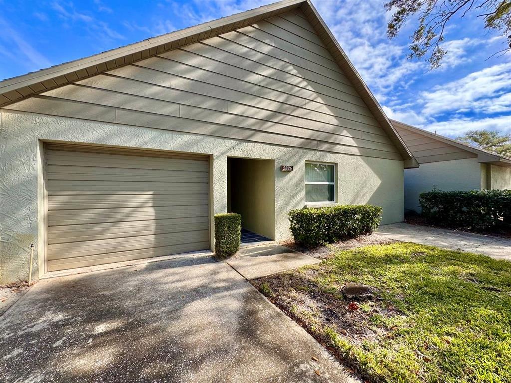 2826 Rampart Circle Clearwater, FL 33761 - Photo 2 of 30 a view of a house with a yard