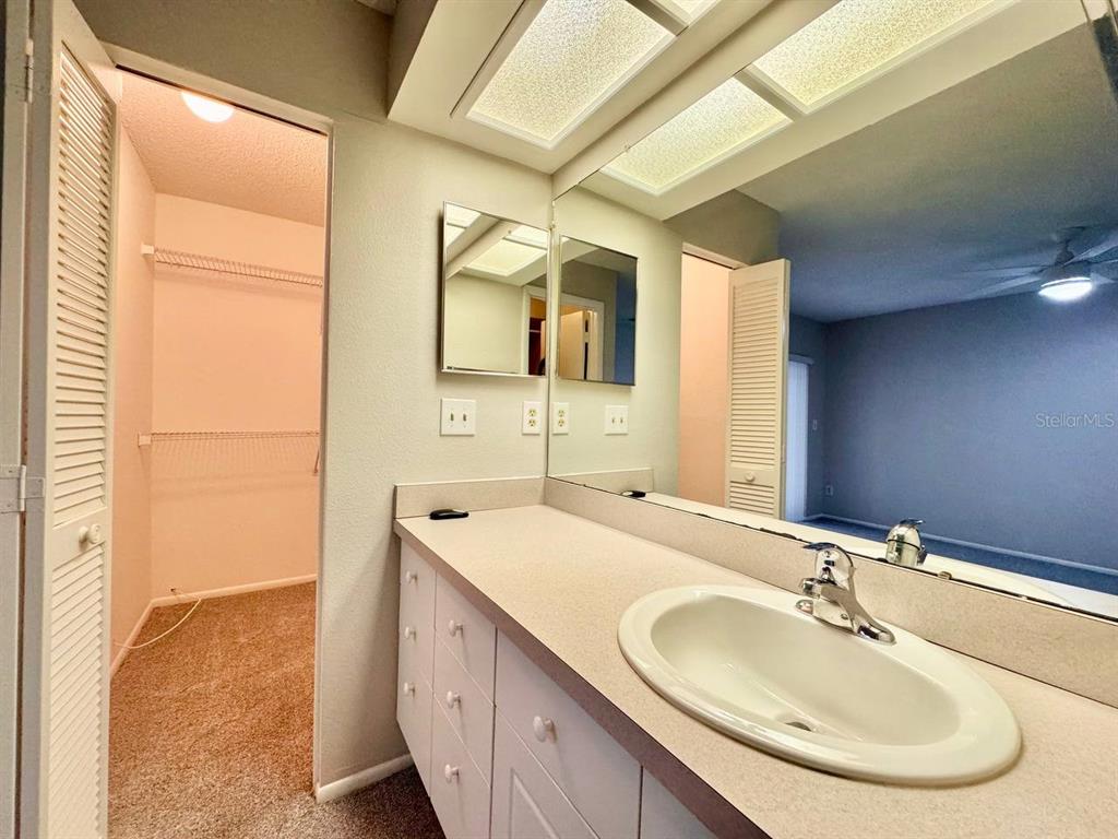 2826 Rampart Circle Clearwater, FL 33761 - Photo 25 of 30 a bathroom with a sink and a mirror