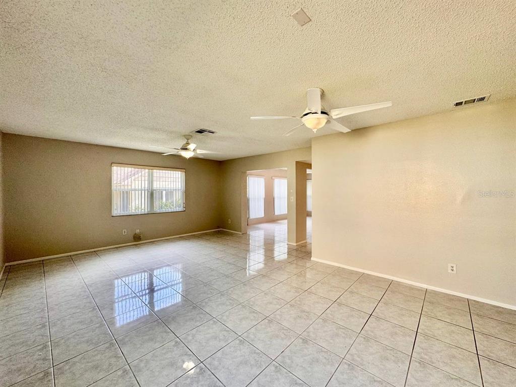 2826 Rampart Circle Clearwater, FL 33761 - Photo 4 of 30 wooden floor in an empty room with a window