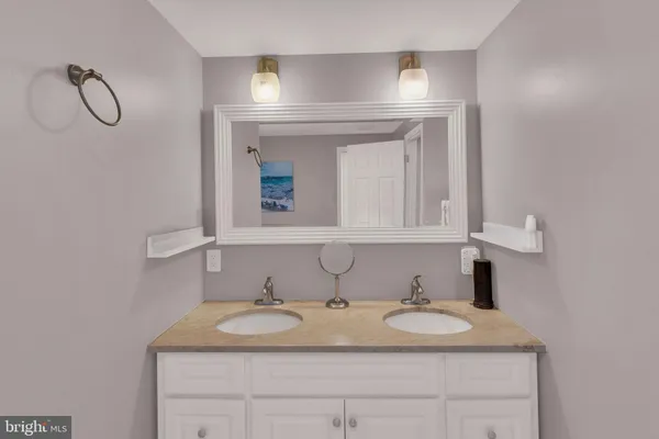 a bathroom with a sink and a mirror