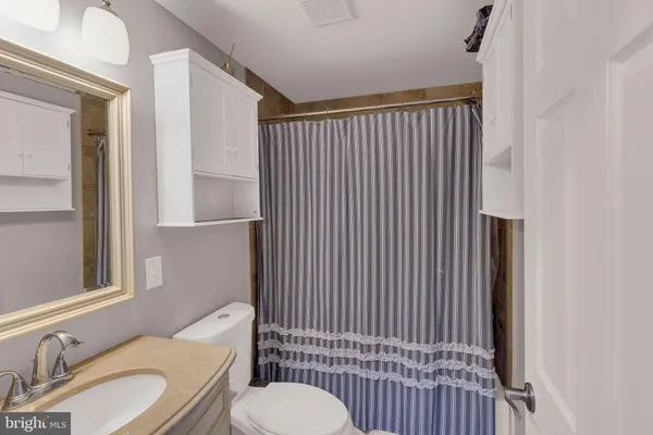 a bedroom with a bed and furniture